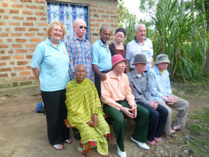 John (back row, middle) and wife Chris (back row, left) with a local family they have befriended in Ukerewe.